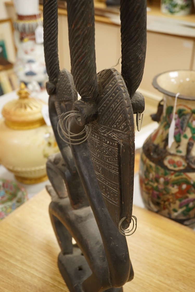 African tribal art interest; a Bambara antelope headdress chiwara, 93cm high